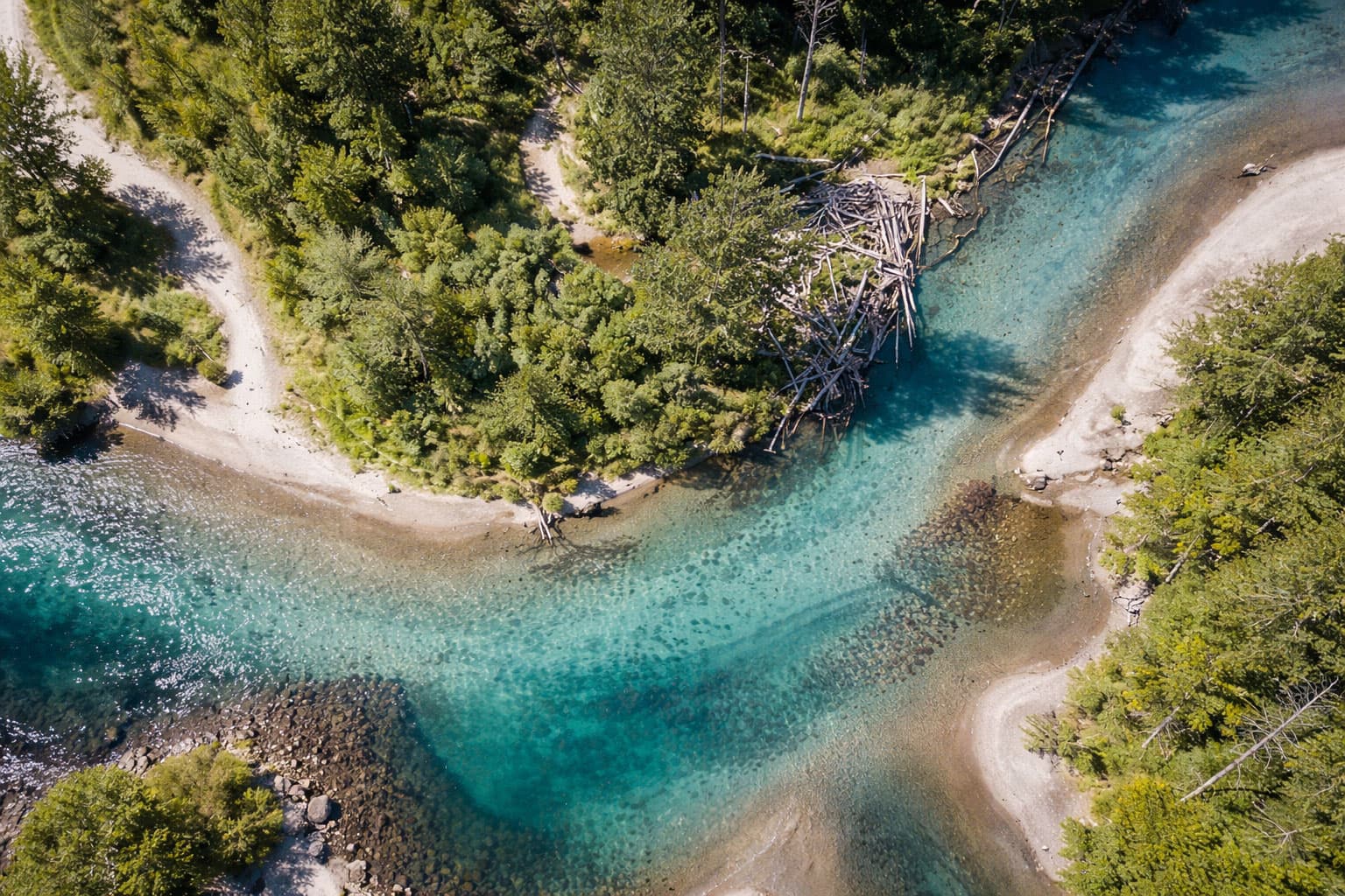 Aerial view of a pristine turquoise river